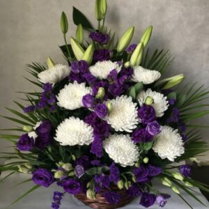 Send purple white flowers in basket