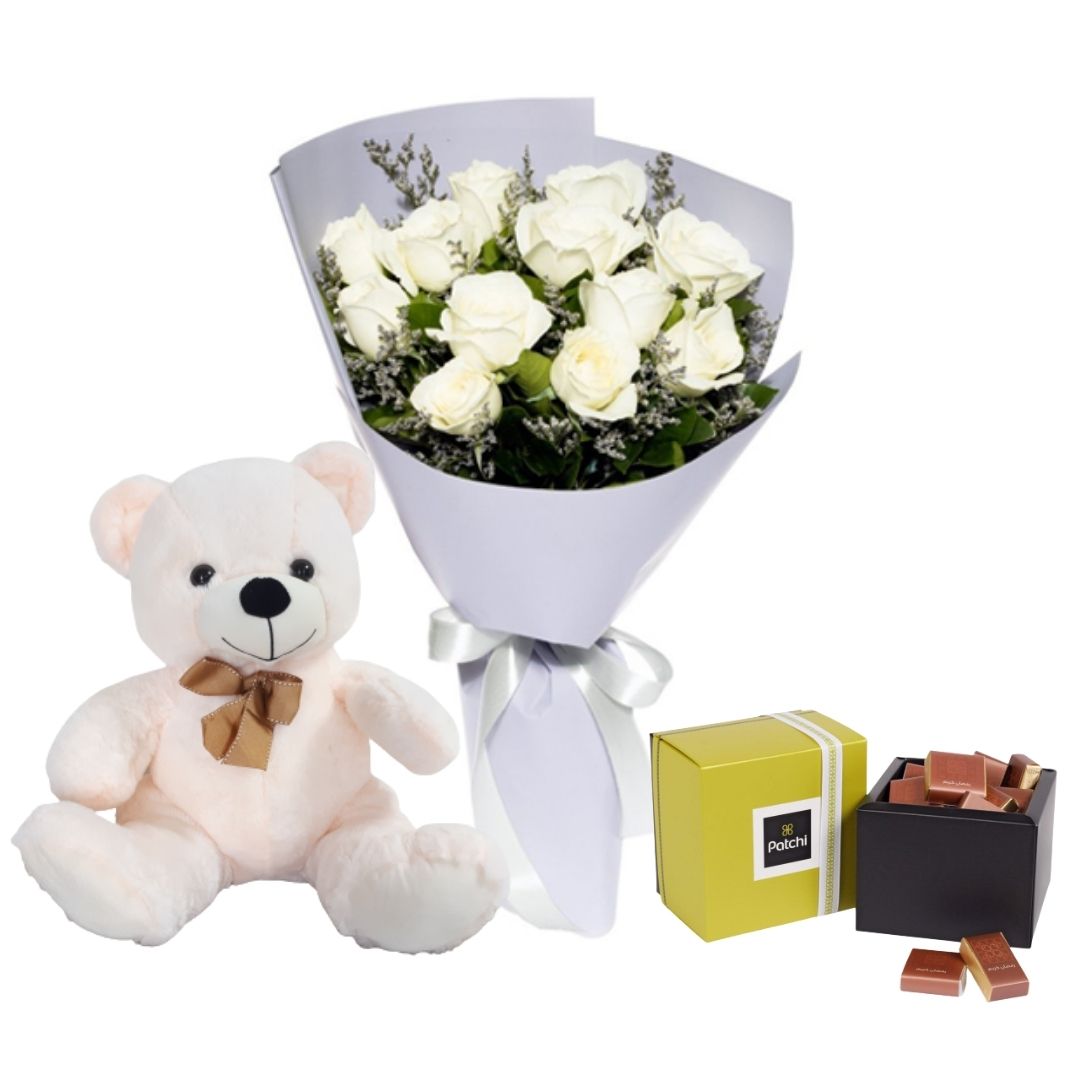 a bouquet of 12 white roses, teddy and chocolates