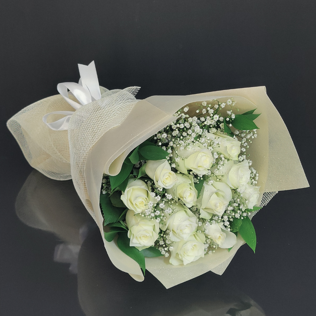 12 white roses as hand bouquet Sharjah