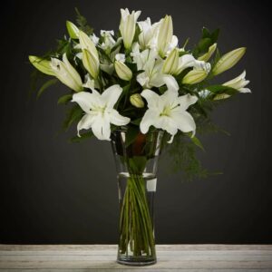 white lilies vase
