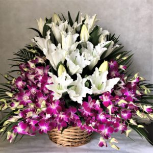 Check how we delivering purple white flowers basket