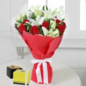 Hand bouquet arrangement of 3 stems white oriental lilies, 6 red roses