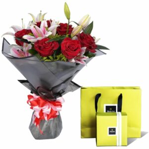 Give the most beautiful 6 red roses 3 pink lily round bouquet