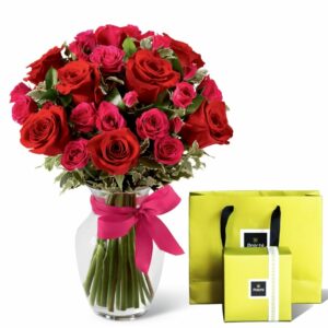 Give beautiful red pink roses in a vase with a patchy chocolate combo